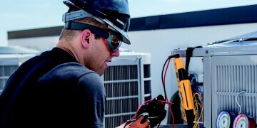 HVAC technician assessing equipment